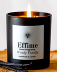 Effime Home Woody Vanilla scented soy candle in a matt black glass jar with vanilla pods