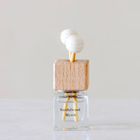 Warm, woody essence of sandalwood with the deep, resinous notes of myrrh Luxury long lasting Sandalwood Myrrh Car diffuser with natural wooden sticks in a clear glass bottle with wooden top