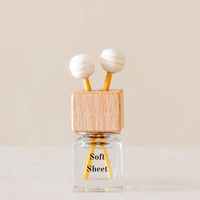 Relax with the scent of clean freshly washed towels of Luxury long lasting Soft Sheets Car diffuser with natural wooden sticks in a
clear glass bottle with wooden top