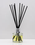 Perfect for slow evenings and quiet moments of reflection Luxury long lasting Tonka Tobacco reed diffuser with natural black sticks in a 100ml clear glass bottle with silver top.