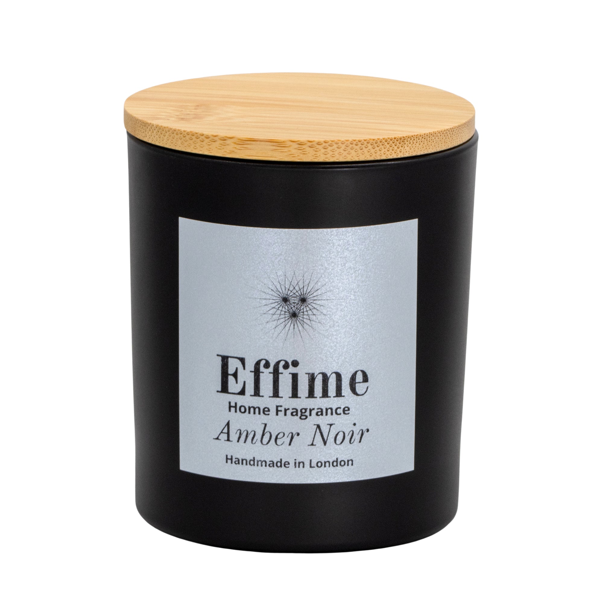 "Scented candle: Black glass jar with silver label reading 'Effime Home Fragrance Amber Noir'. 
Luxury Spicy and Woody home fragrance"