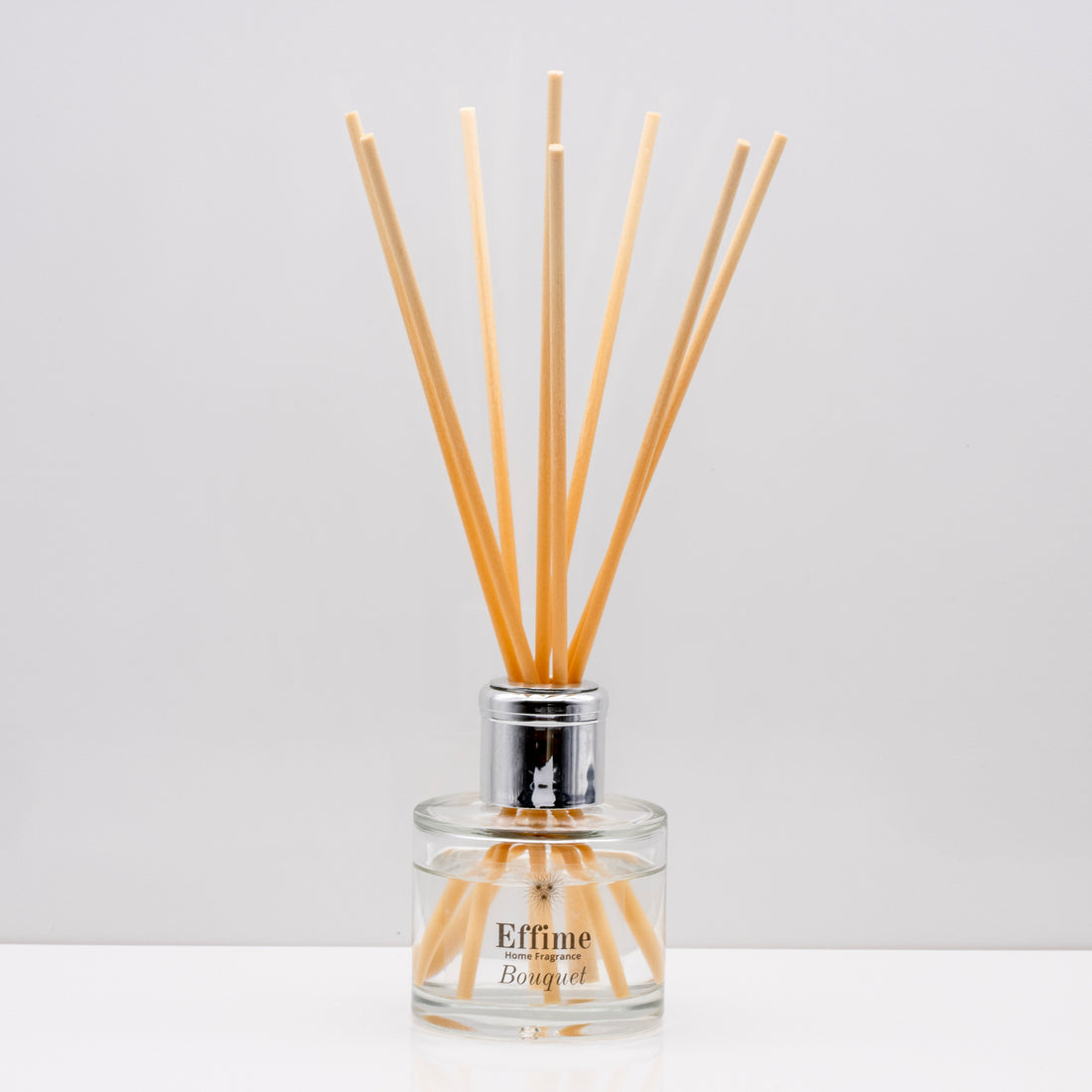 Crisp uplifting aromas of wild meadow flowers and morning dew, nestled on a bed of sweet amber Luxury long lasting Bouquet reed diffuser with natural wooden sticks in a 100ml clear glass bottle with silver top.