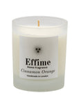 "Scented candle: frosted white  glass jar with white label reading 'Effime Home Fragrance Cinnamon Orange'. 
Luxury  Spicy, Woody, Fruity home fragrance"