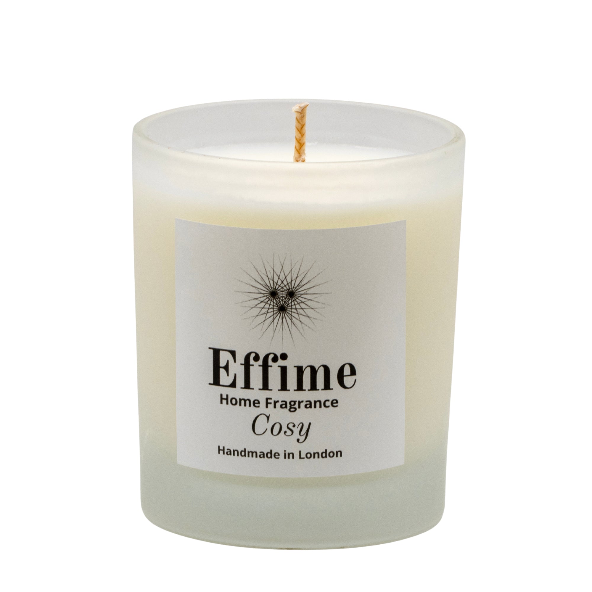 "Scented candle: frosted white  glass jar with white label reading 'Effime Home Fragrance Cosy'. 
Luxury  Spicy, Woody, Fruity home fragrance"