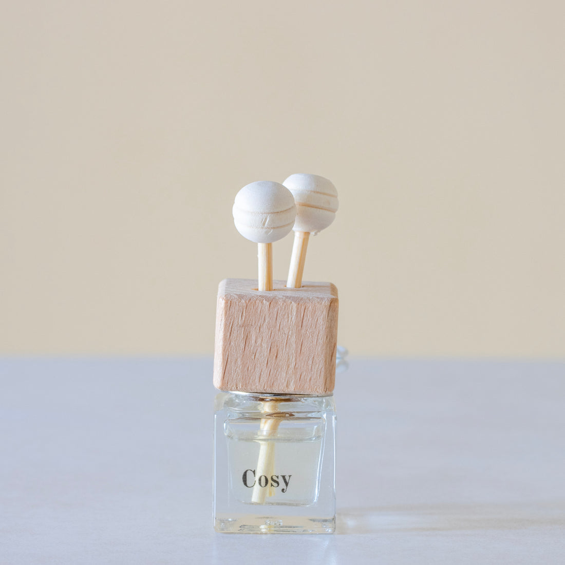 Sweet cinnamon, fresh orange, and woody clove lending itself to spicy and yet citrus aroma Luxury long lasting cosy Car diffuser with natural wooden sticks in a  clear glass bottle with wooden top.