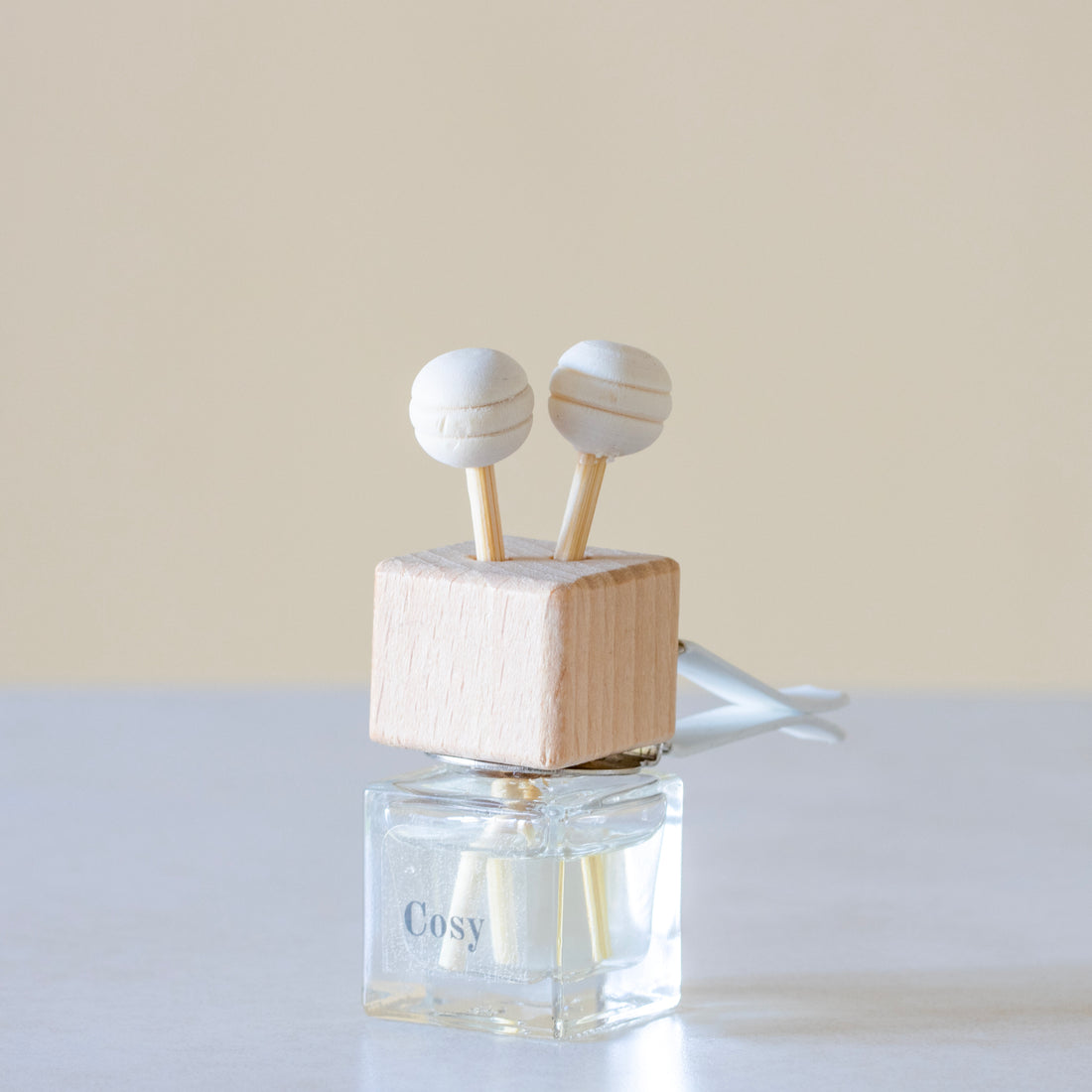 Sweet cinnamon, fresh orange, and woody clove lending itself to spicy and yet citrus aroma Luxury long lasting cosy Car diffuser with natural wooden sticks in a  clear glass bottle with wooden top.