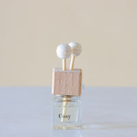 Sweet cinnamon, fresh orange, and woody clove lending itself to spicy and yet citrus aroma Luxury long lasting cosy Car diffuser with natural wooden sticks in a  clear glass bottle with wooden top.