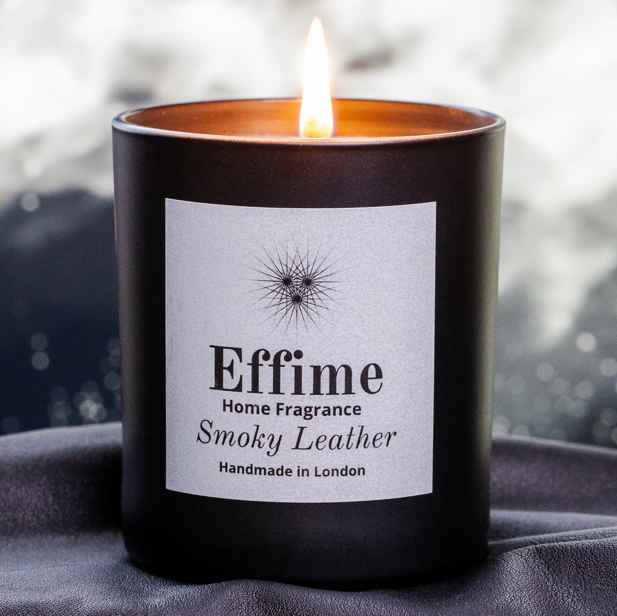 Effime Home Smoky Leather scented soy lit candle in a matt black glass jar1.