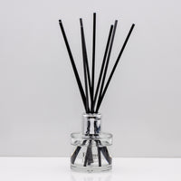 Relax in the exquisitely encapsulated, fresh aromatic herbal notes of Luxury long lasting lavender reed diffuser with natural black sticks in a 100ml clear glass bottle with silver top