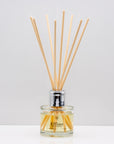 Citrus notes and warm freshly sliced ginger Luxury long lasting Lemongrass Ginger reed diffuser with natural wooden sticks in a 100ml clear glass bottle with silver top