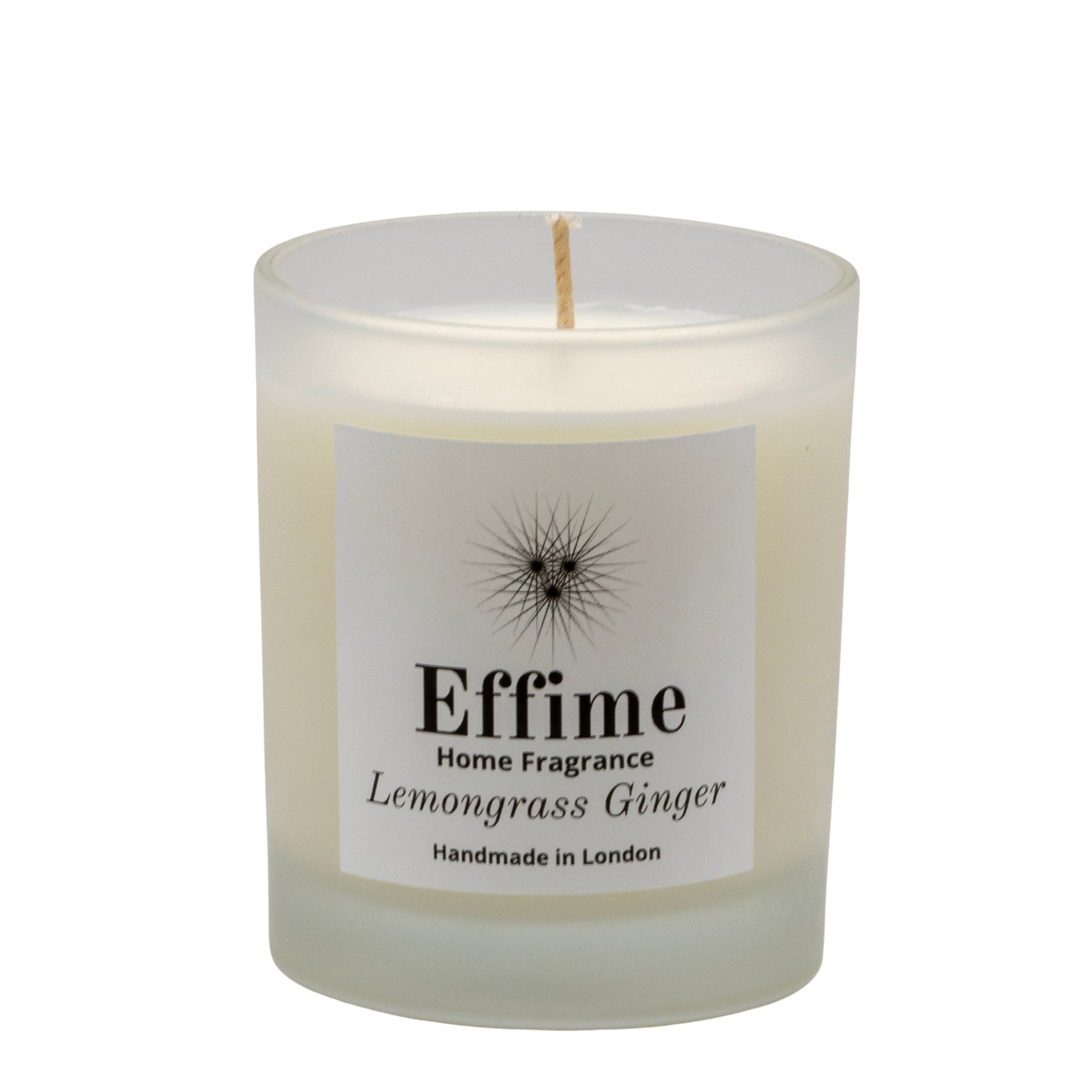 "Scented candle: frosted white  glass jar with white label reading 'Effime Home Fragrance Lemongrass Ginger'. 
Luxury  Fresh home fragrance"