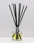 A delightful blend of sweet orange, mandarin and zesty lemon with subtle notes of bergamot Luxury long lasting Orange reed diffuser with natural black sticks in a 100ml clear glass bottle with silver top.