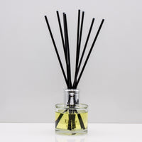 A delightful blend of sweet orange, mandarin and zesty lemon with subtle notes of bergamot Luxury long lasting Orange reed diffuser with natural black sticks in a 100ml clear glass bottle with silver top.