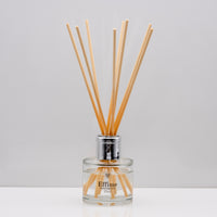 Experience the warm rich, smoky essence of rare Oud wood Luxury long lasting Oud reed diffuser with natural wooden sticks in a 100ml clear glass bottle with silver top