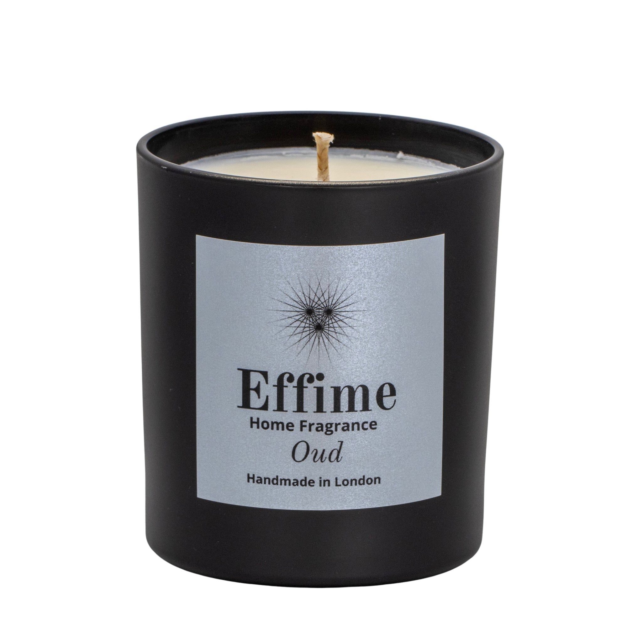 "Scented candle: Black glass jar with silver label reading 'Effime Home Fragrance Oud'. 
Luxury   Spicy and Woody home fragrance"