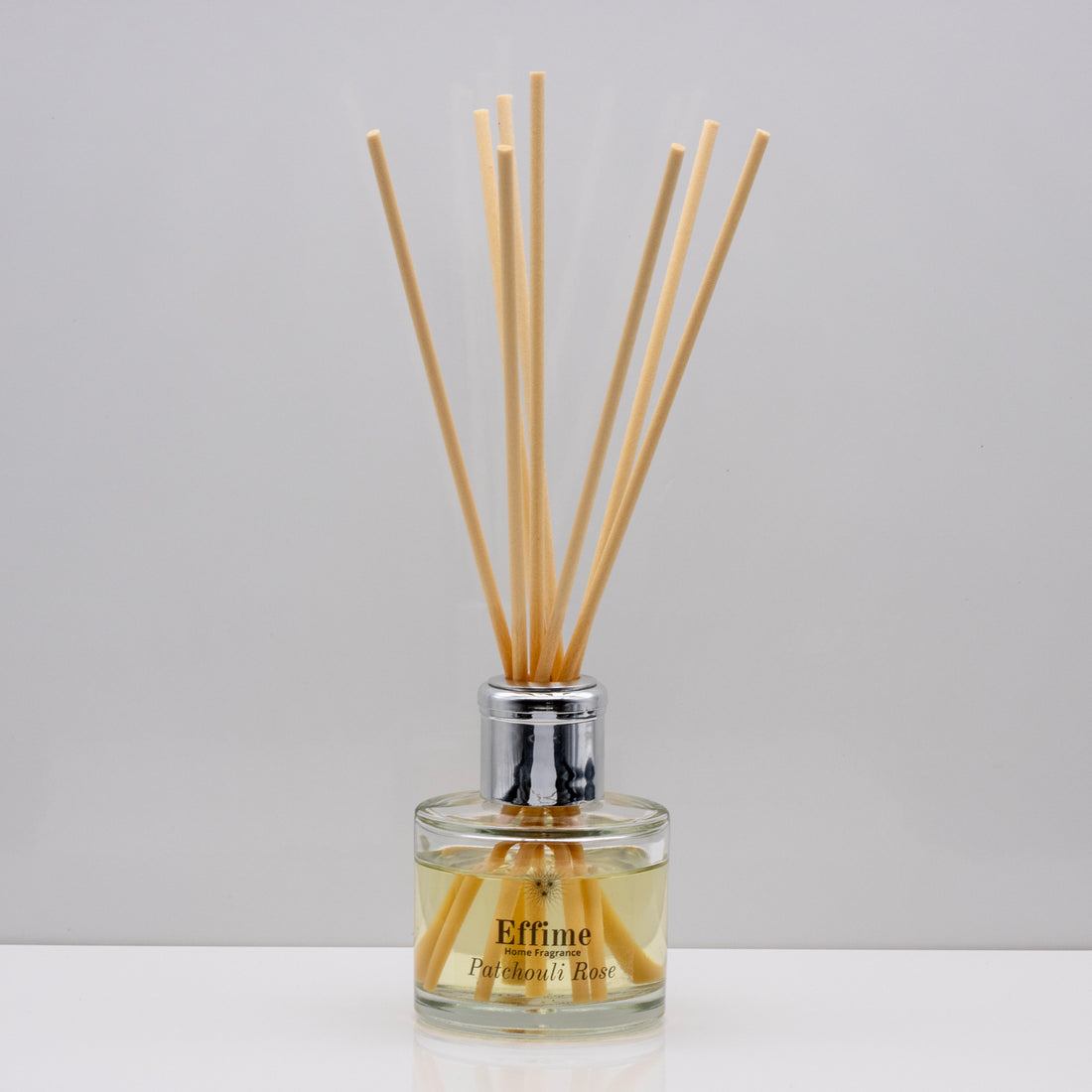 Rich decadent dark fruits with floral notes of rose, jasmine and fragrant patchouli Luxury long lasting Patchouli Rose reed diffuser with natural wooden sticks in a 100ml clear glass bottle with silver top