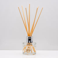 warm, woody essence of sandalwood with the deep, resinous notes of myrrh Luxury long lasting Sandalwood Myrrh reed diffuser with natural wooden sticks in a 100ml clear glass bottle with silver top