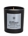 "Scented candle: Black glass jar with silver label reading 'Effime Home Fragrance Sandalwood Myrrh'. 
Luxury Spicy and Woody home fragrance"