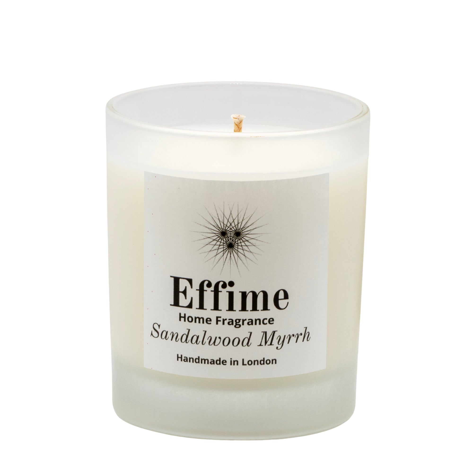 "Scented candle: frosted white  glass jar with white label reading 'Effime Home Fragrance Sandalwood Myrrh'. 
Luxury Spicy and Woody home fragrance"