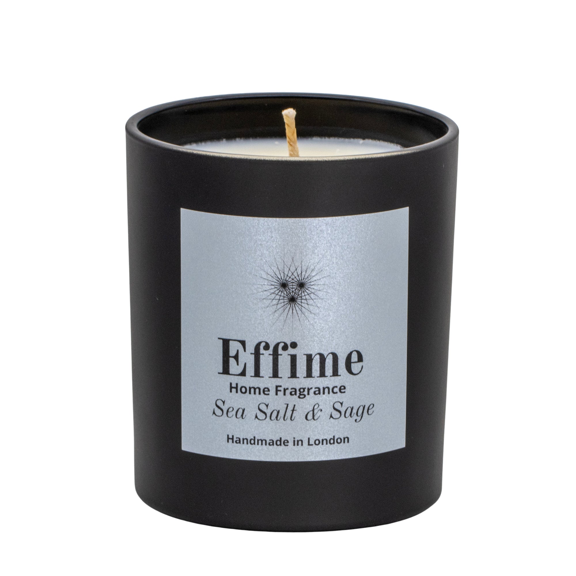 "Scented candle: Black glass jar with silver label reading 'Effime Home Fragrance Sea Salt & Sage'. 
Luxury Fresh and spicy home fragrance"
