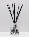 Take a stroll through an English garden, with inviting rose Luxury long lasting Simply Rose reed diffuser with natural black sticks in a 100ml clear glass bottle with silver top.